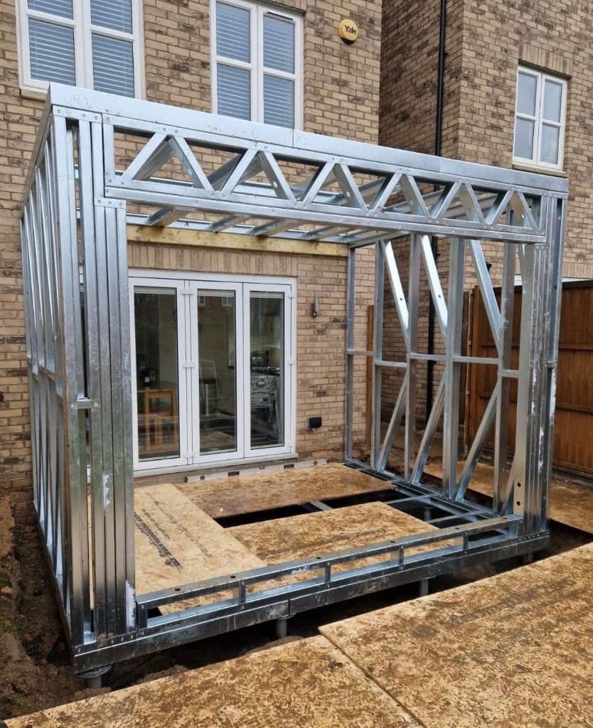 L-shaped light gauge steel frame home extension on screw piles