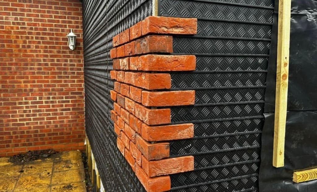 Prefabricated steel framing panels stacked with assembly reference marks