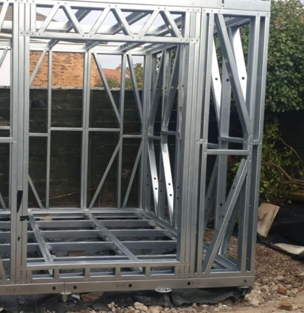 Two-storey light gauge steel frame extension with large glazing openings